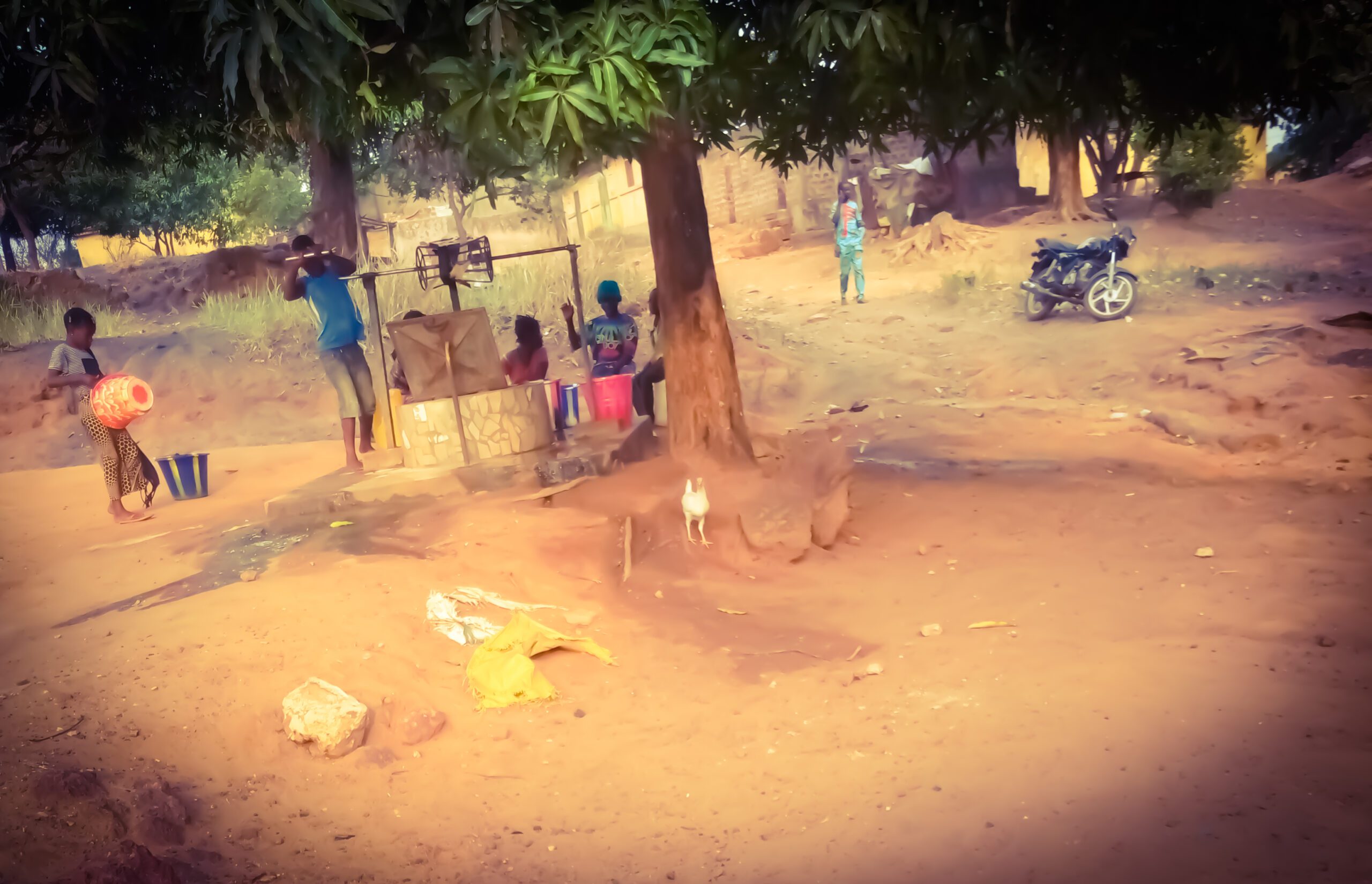 Residents collect water at a well in Guinea in April 2021; illustrative file photograph.