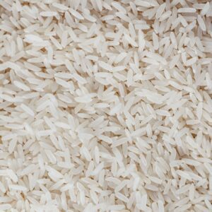 Uncooked white rice grains, illustrative product photograph